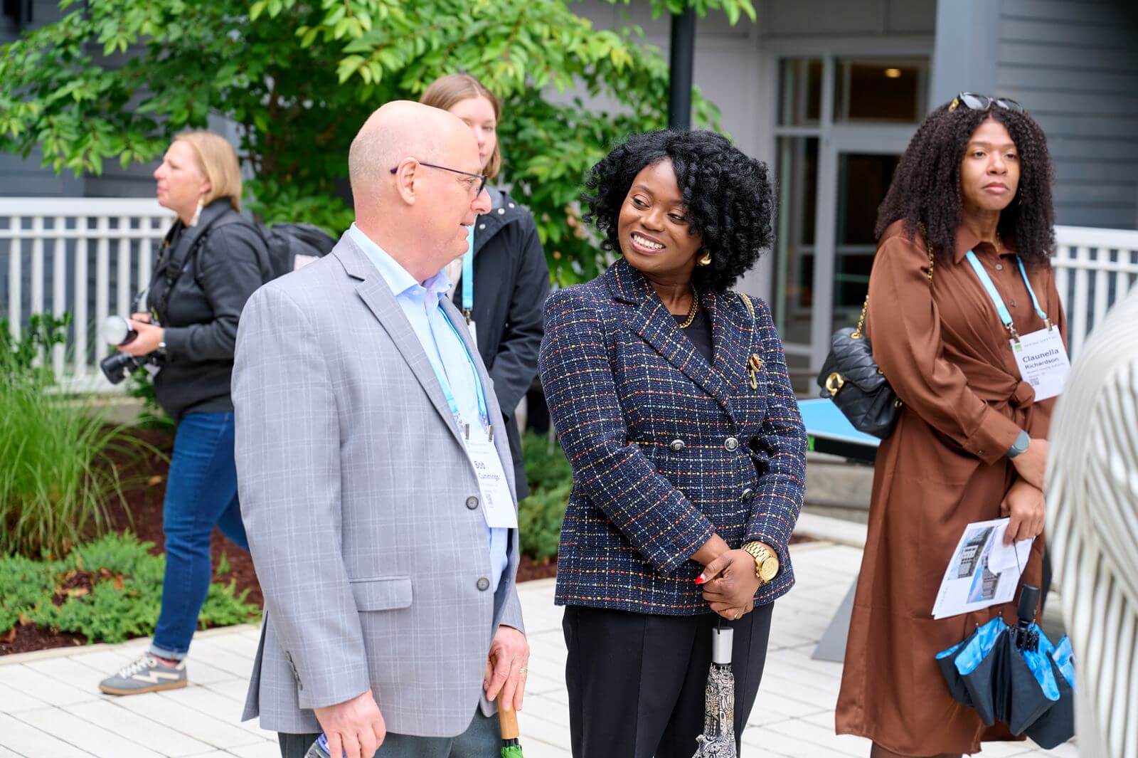Guests talking outside a development
